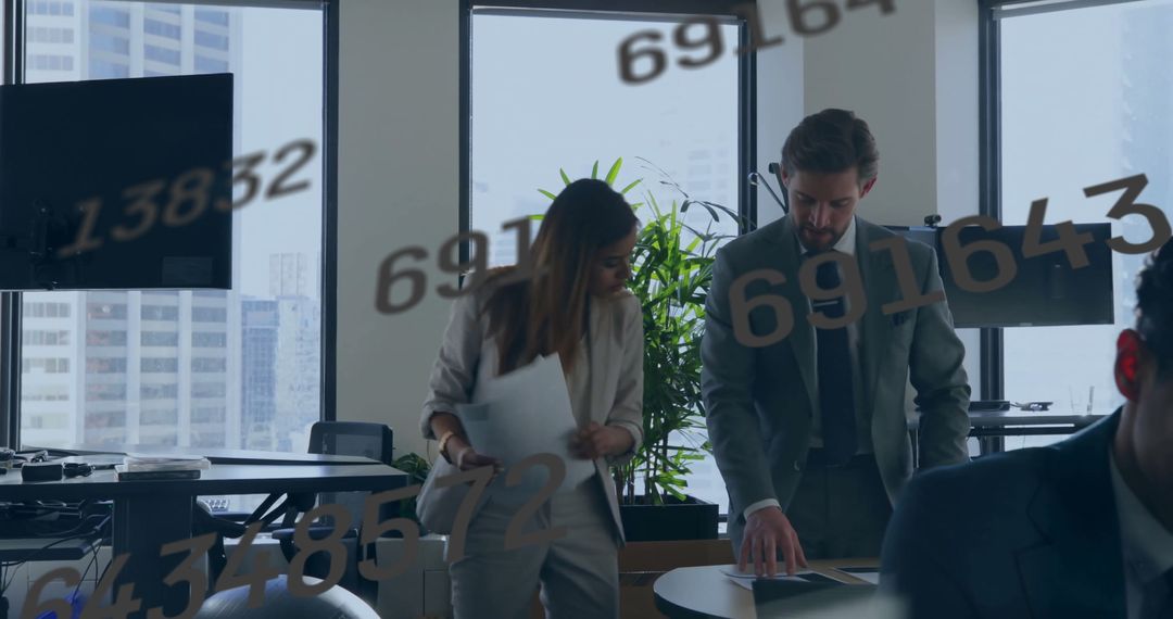Diverse Team Discussing Financial Data in Modern Office Setting