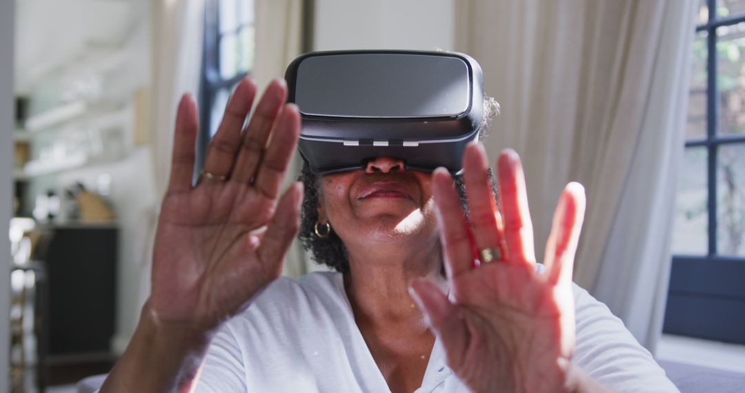 Senior Woman Exploring Virtual Reality - Free Images, Stock Photos and Pictures on Pikwizard.com