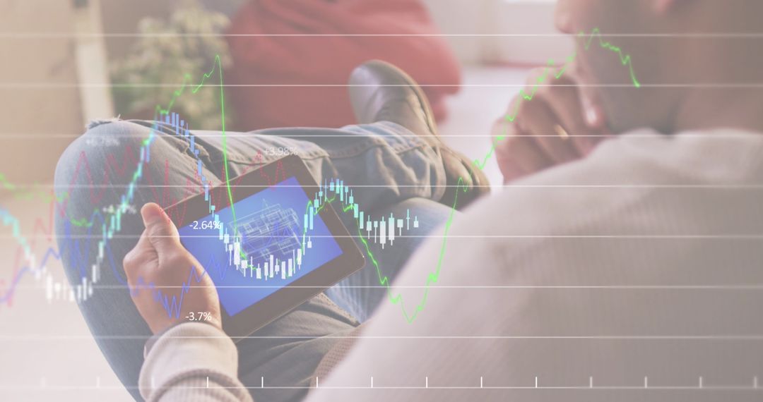Businessman Analyzing Data on Tablet with Stock Charts Overlay