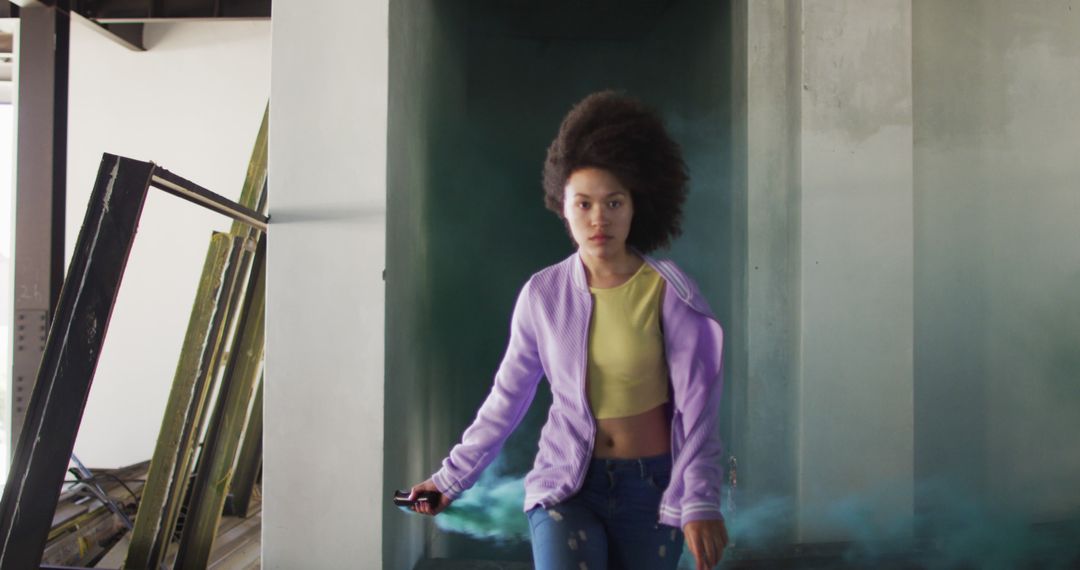 Woman with Green Flare Exploring Abandoned Building