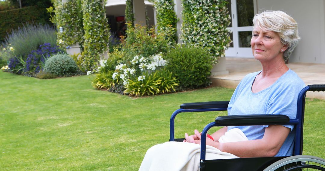 Senior Woman in Wheelchair Smiling in Tranquil Garden - Free Images, Stock Photos and Pictures on Pikwizard.com