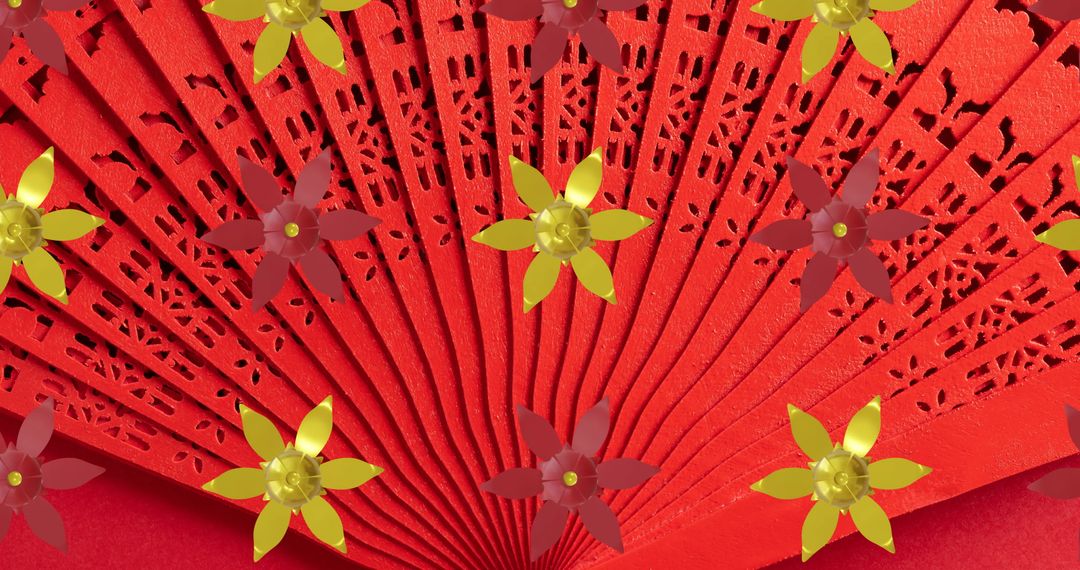 Elegant Chinese Art Fan with Floral Holes on Red Background - Free Images, Stock Photos and Pictures on Pikwizard.com