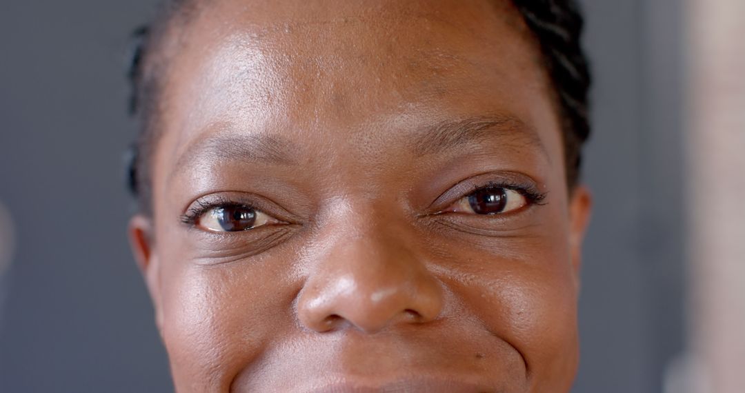 Close-up of Smiling Woman with Braided Hair Showing Joyful Expression