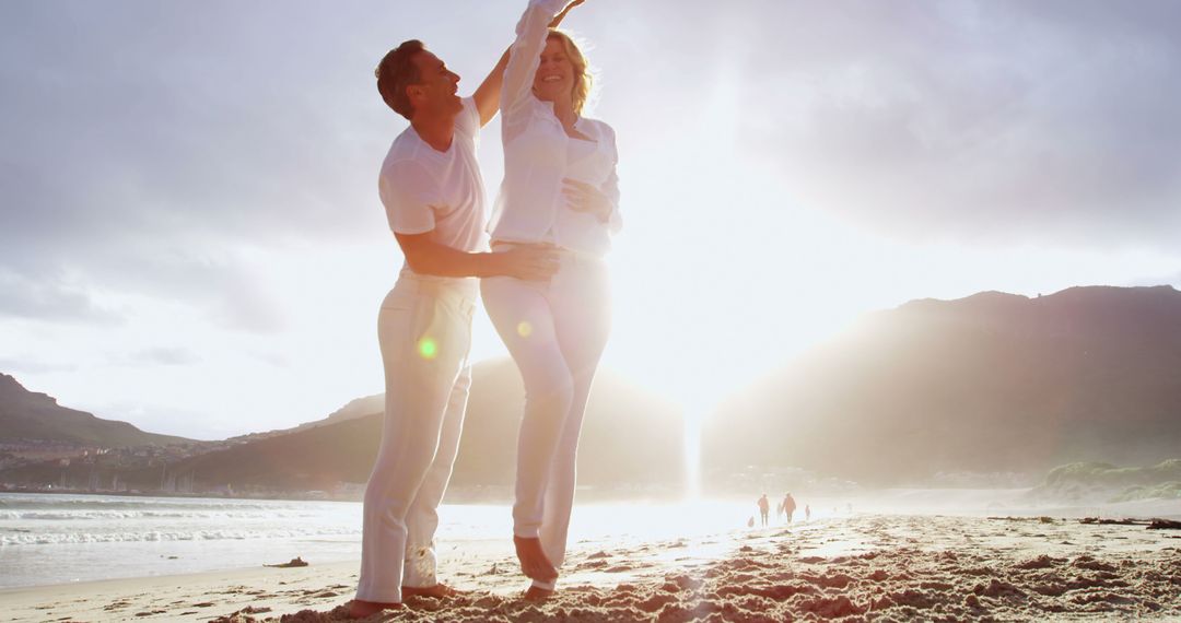 Couple Dancing on Beach at Sunset, Enjoying Romantic Moment - Free Images, Stock Photos and Pictures on Pikwizard.com