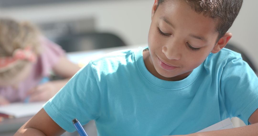 Focused Students Writing in Classroom, Engaging School Environment