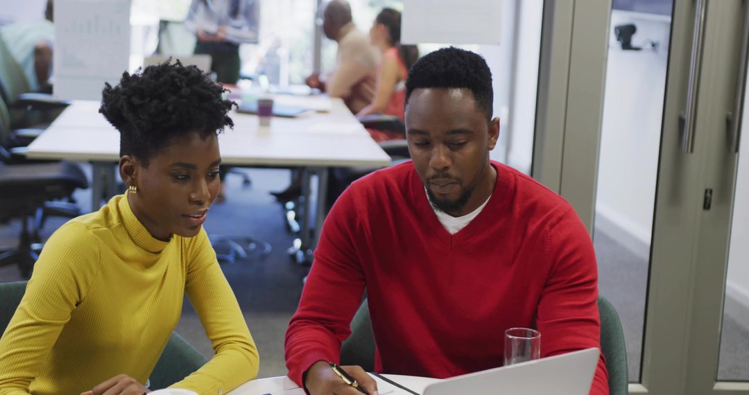 Team Collaboration in Modern Office with Laptop and Digital Tools