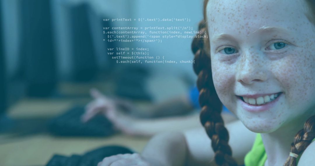 Smiling Child Learning Programming on Laptop