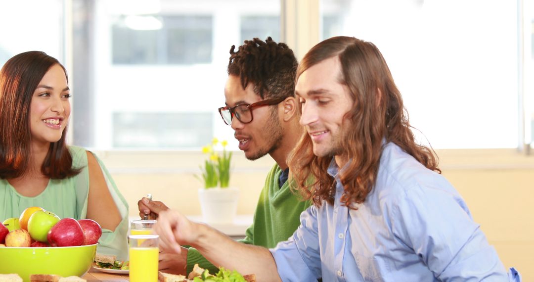 Diverse Friends Enjoying Meal and Engaging Conversation