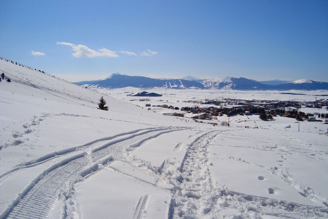 Scenic Snowy Mountain Landscape with Snow Tracks - Free Images, Stock Photos and Pictures on Pikwizard.com