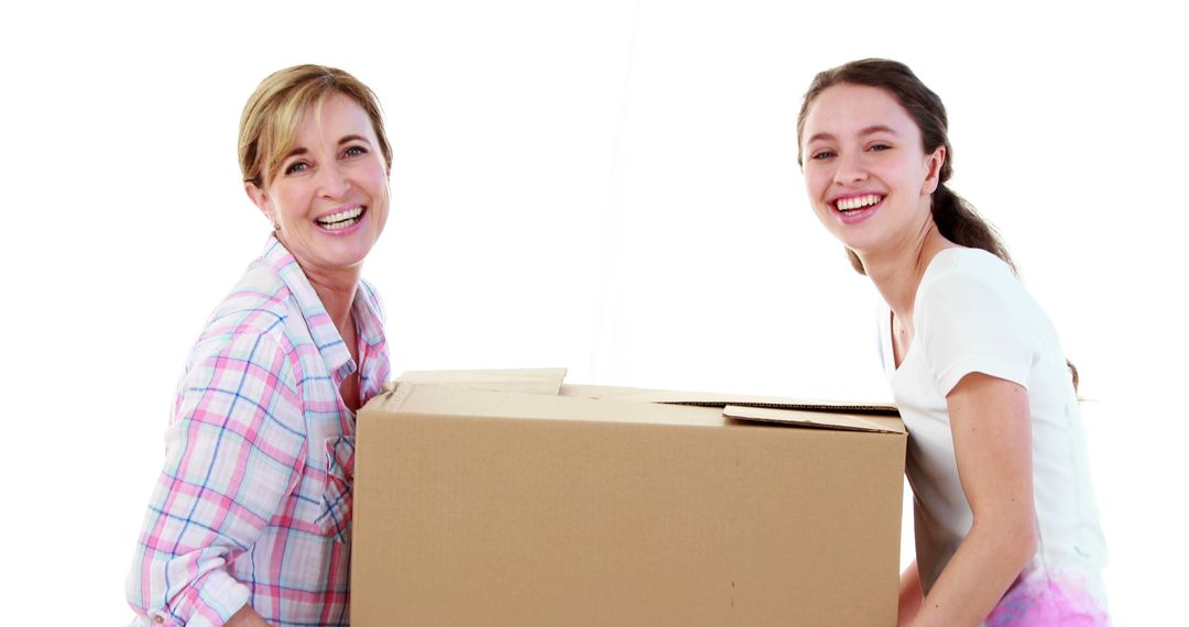 Mother and Daughter Moving Box Together - Free Images, Stock Photos and Pictures on Pikwizard.com