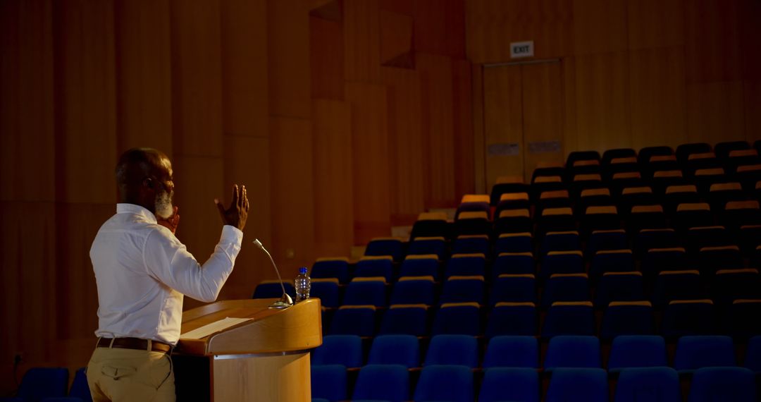 Professional Preparing Speech in Empty Auditorium