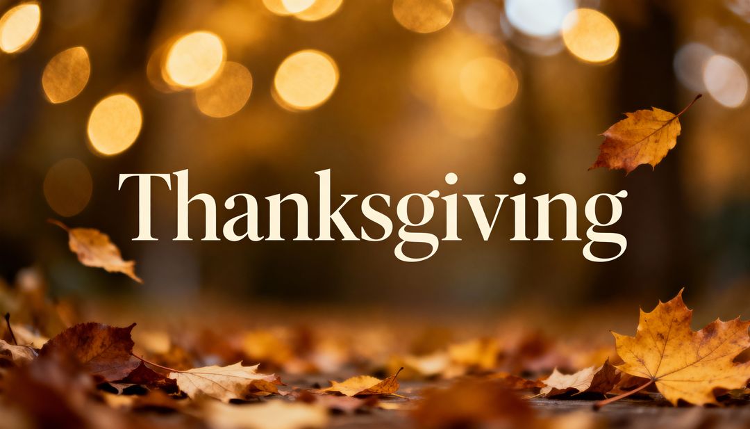 Thanksgiving Greeting with Floating Maple Leaves and Warm Golden Bokeh Background