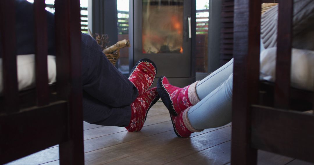 Couple With Cozy Socks Warming Feet by Fireplace - Free Images, Stock Photos and Pictures on Pikwizard.com