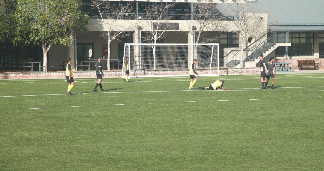 Youth Soccer Team Practicing Drills on Green Field