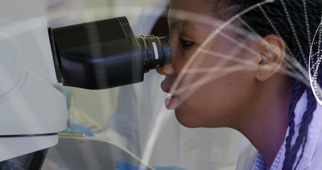 Scientist Using Microscope with DNA Double Helix Overlay