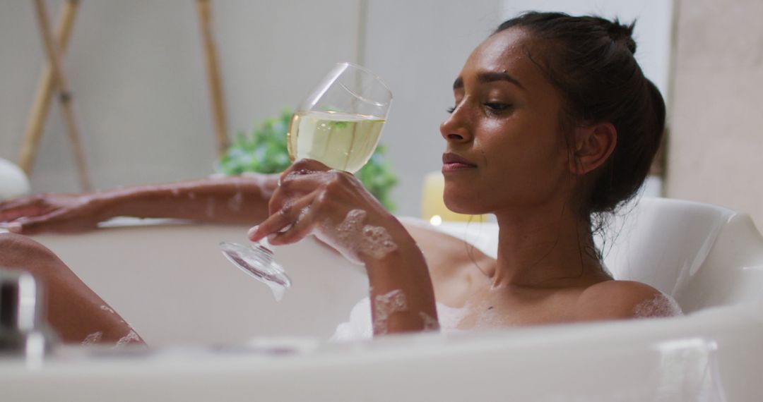 Relaxed Woman Drinking Wine in Bathtub and Unwinding - Free Images, Stock Photos and Pictures on Pikwizard.com