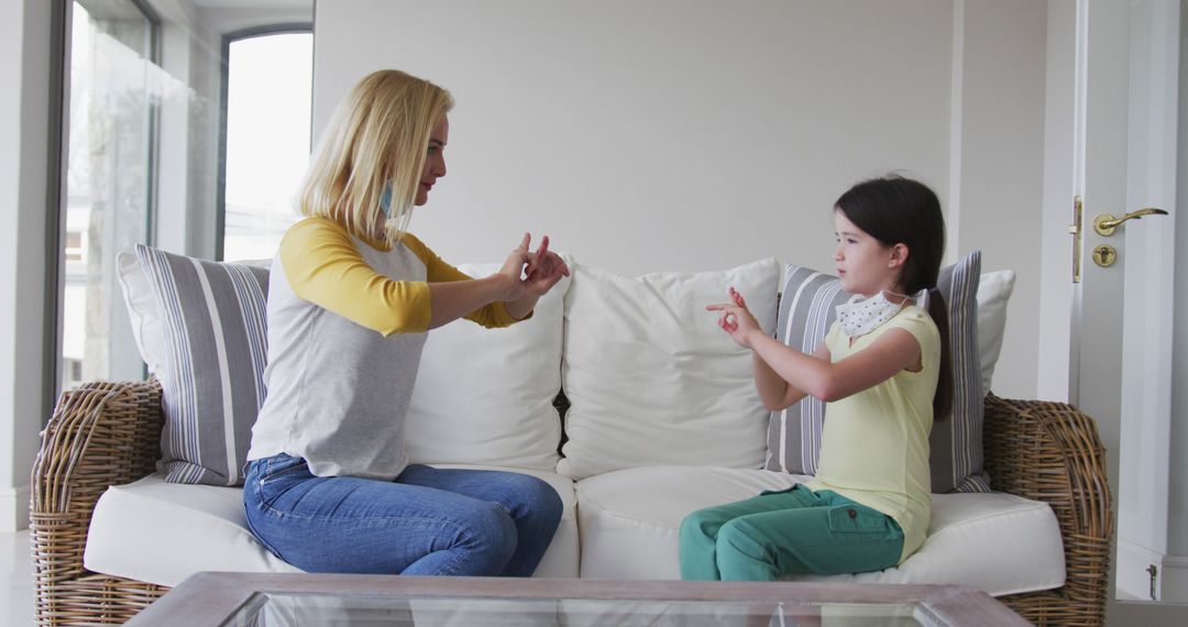 Mother and Daughter Communicating in Sign Language at Home - Free Images, Stock Photos and Pictures on Pikwizard.com