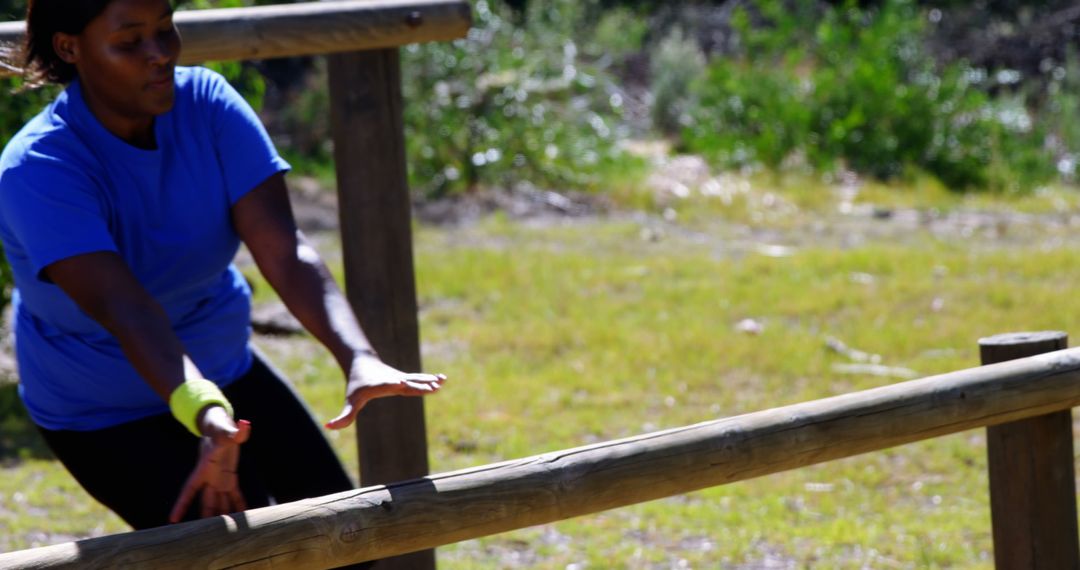 Woman Overcoming Obstacle at Outdoor Training Course - Free Images, Stock Photos and Pictures on Pikwizard.com