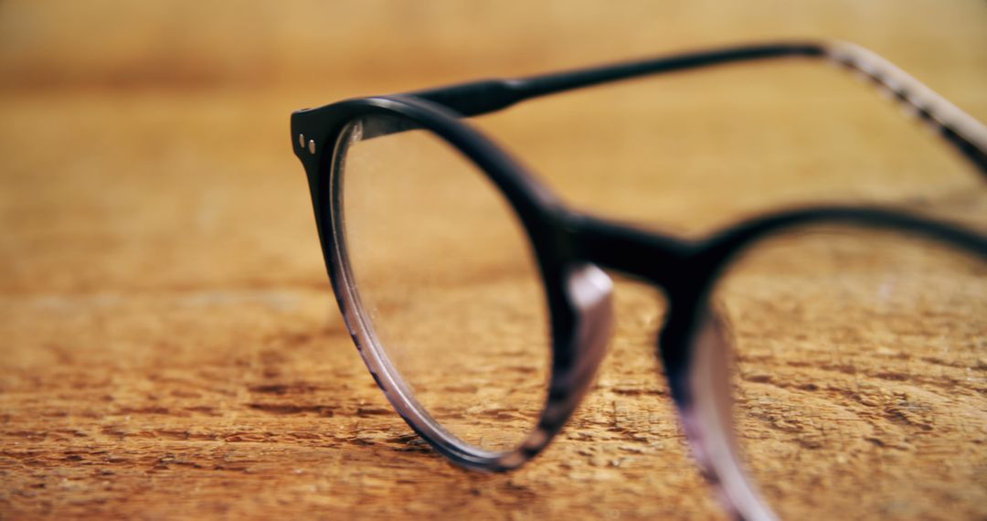 Close-Up of Vintage Eyeglasses on Wooden Table - Free Images, Stock Photos and Pictures on Pikwizard.com