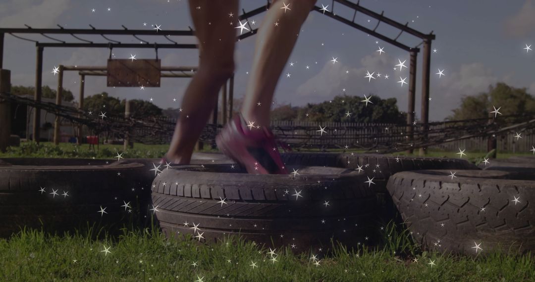 Woman Navigating Tire Obstacle Course in Stylish Pink Running Shoes
