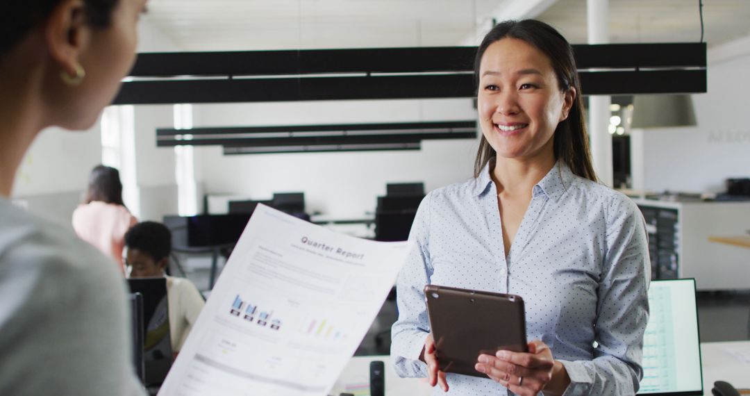 Confident Businesswoman Discussing Quarterly Report in Modern Office