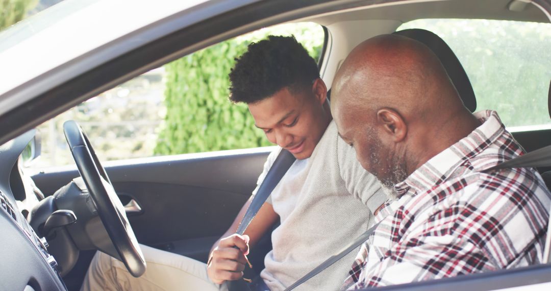 Father and Son Bonding While Buckling Up for Safe Drive