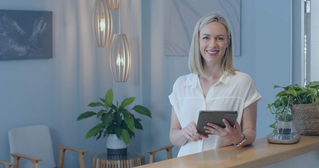 Receptionist Smiling Behind Desk with Modern Decor