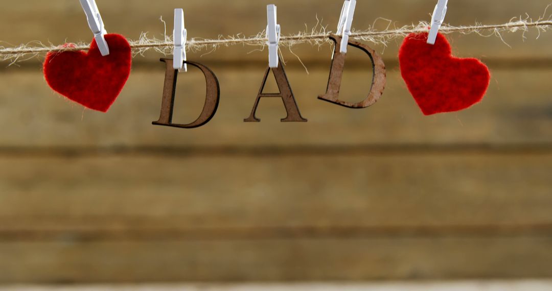 Cute DIY Father’s Day Garland Featuring Letters and Red Hearts - Free Images, Stock Photos and Pictures on Pikwizard.com