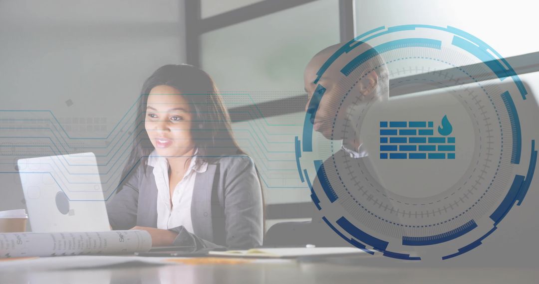 Business team working on laptop with cybersecurity overlay and blueprints