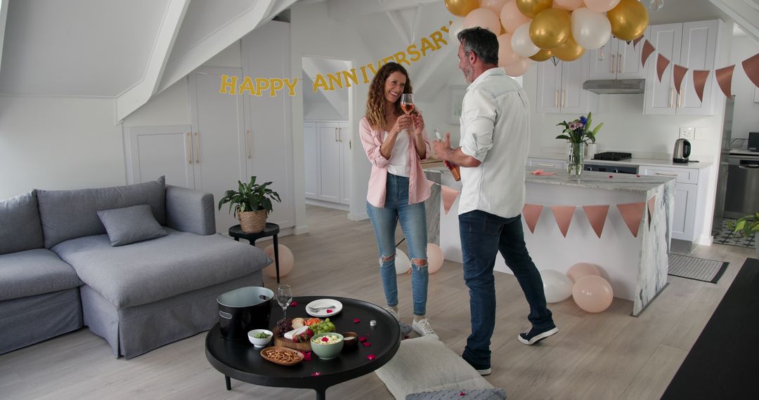 Happy couple celebrating anniversary with wine