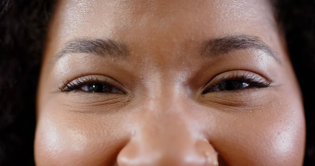 Close-Up Portrait of African American Woman's Eyes Smiling - Free Images, Stock Photos and Pictures on Pikwizard.com