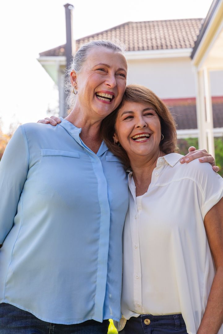 Diverse Friends Laughing Joyfully in Suburban Backdrop
