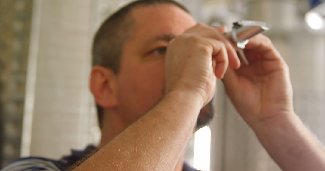 Man Using Razor For Shaving in Bathroom - Free Images, Stock Photos and Pictures on Pikwizard.com