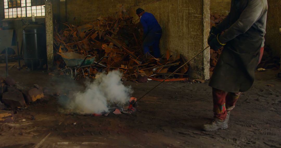 Industrial Workers Handling Hot Metal in Workshop - Free Images, Stock Photos and Pictures on Pikwizard.com