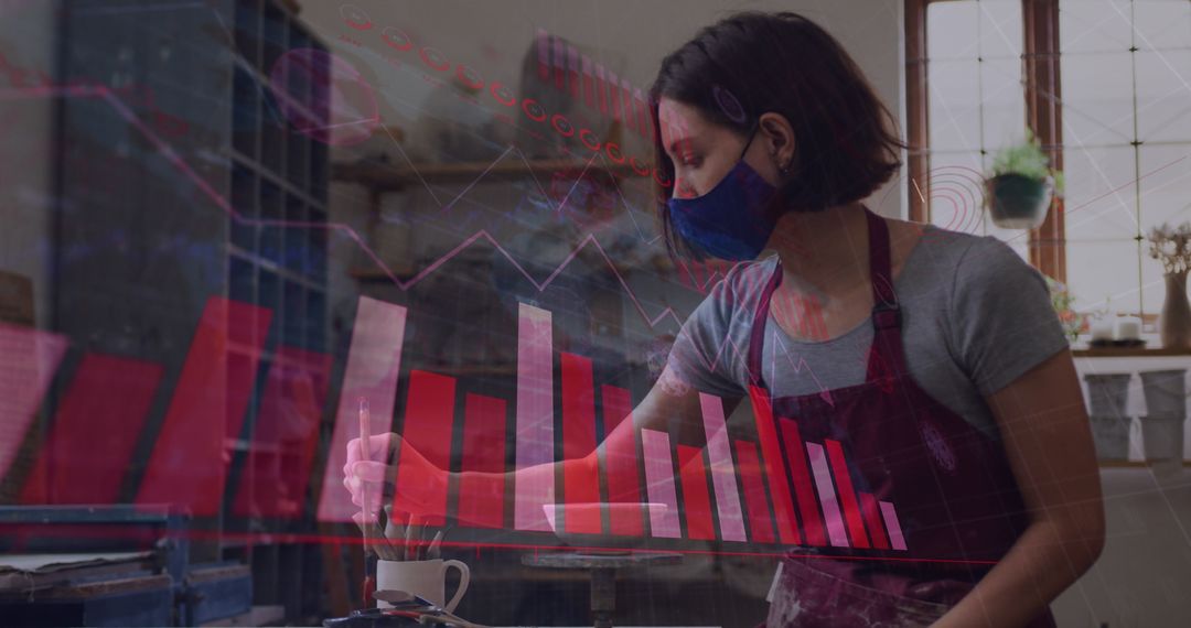 Woman in Pottery Studio with Digital Covid-19 Data Overlay
