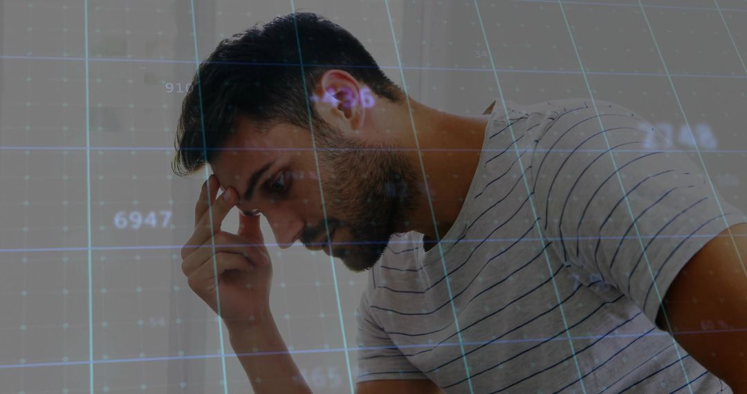 Bearded Man Analyzing Digital Data Overlays in Office Environment