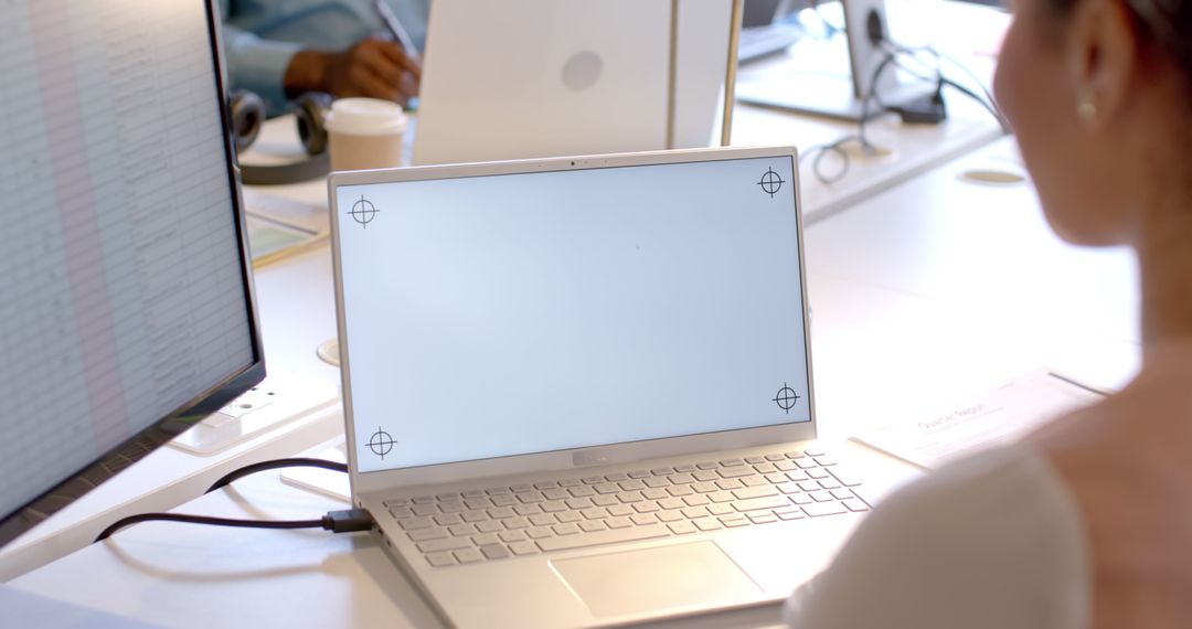 Business Professional Using Laptop with Blank Screen for Copy Space