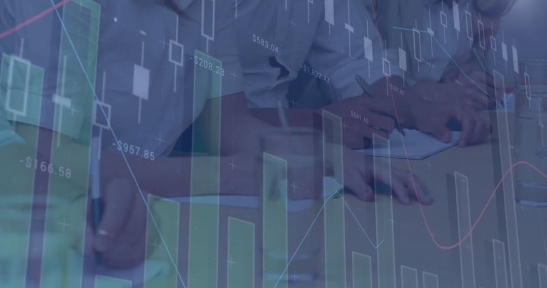 Business Colleagues Analyzing Financial Graphs in Office Meeting