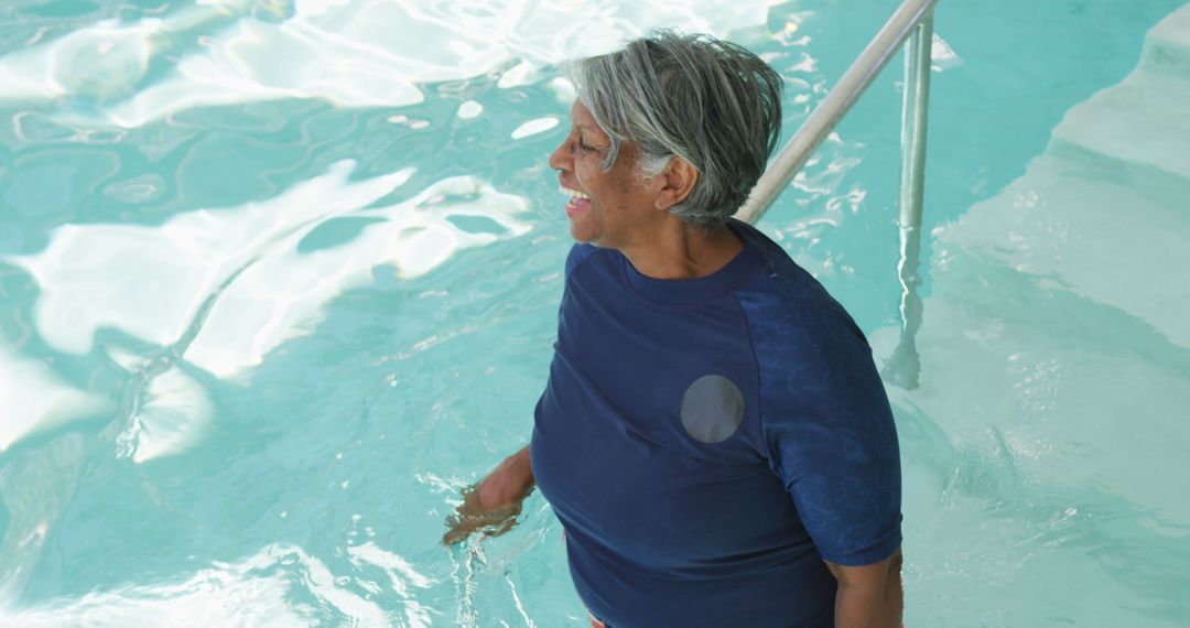 Joyful Senior African American Woman in Swimming Pool - Free Images, Stock Photos and Pictures on Pikwizard.com