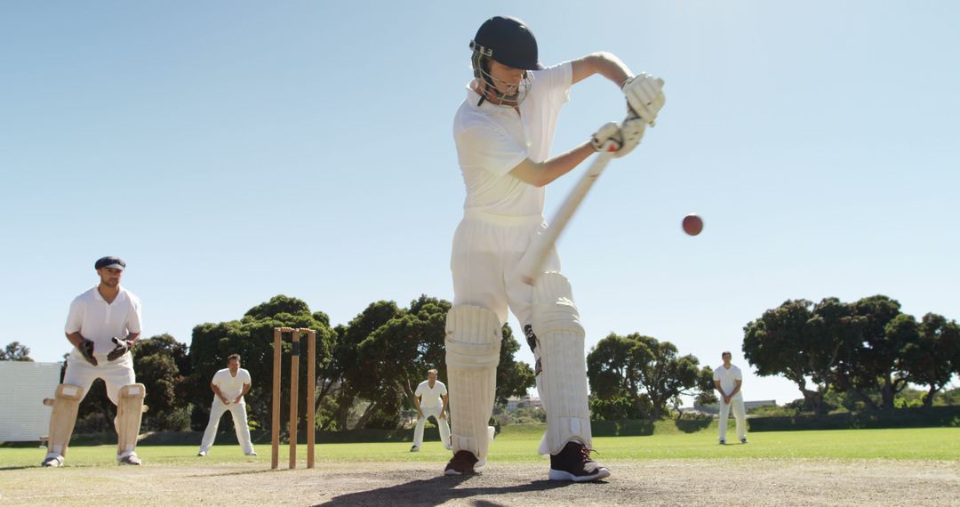 Male Cricketer Batting on Outdoor Field in Mid-action on Sunny Day - Free Images, Stock Photos and Pictures on Pikwizard.com