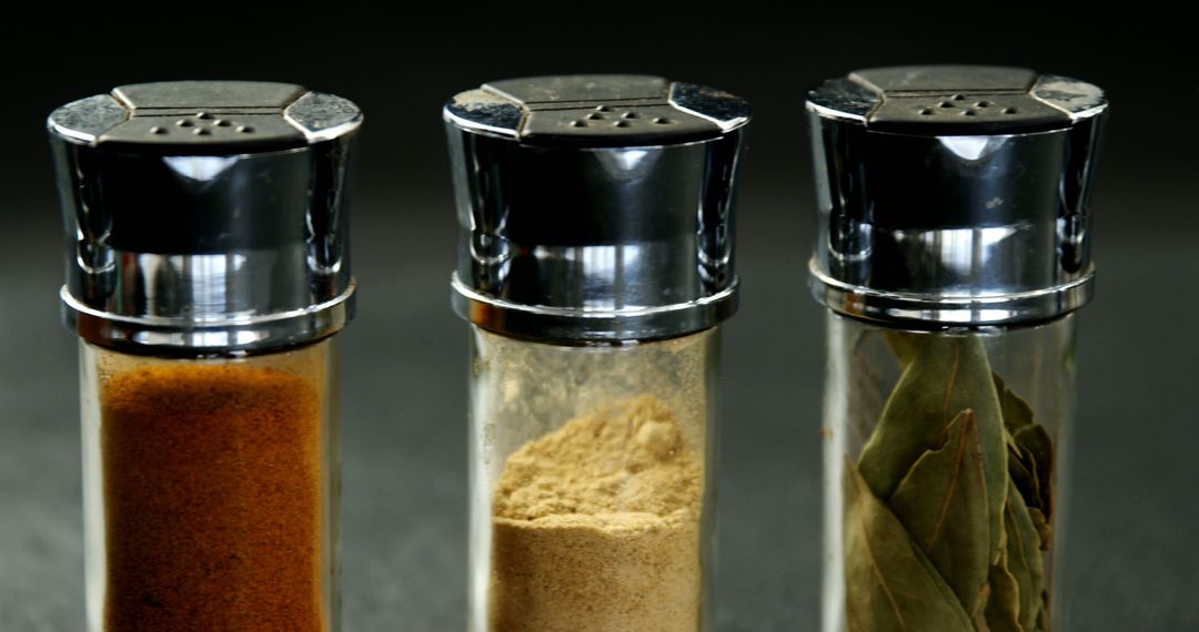 Trio of Spice Shakers with Assorted Spices - Free Images, Stock Photos and Pictures on Pikwizard.com