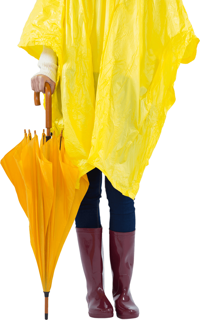 Low Section of Woman in Yellow Transparent Raincoat Holding Umbrella