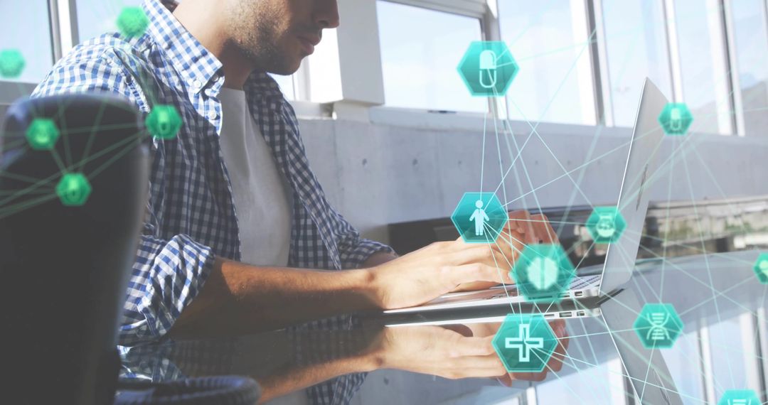 Man Typing at Glass Desk with Digital Innovation Icons