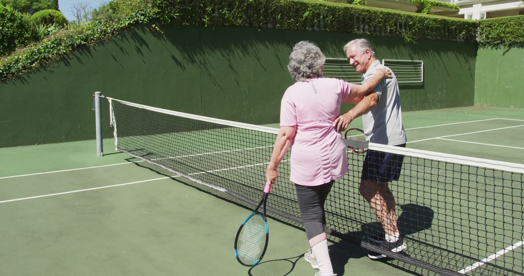 Senior Couple Handshaking after Tennis Match on Outdoor Court - Free Images, Stock Photos and Pictures on Pikwizard.com