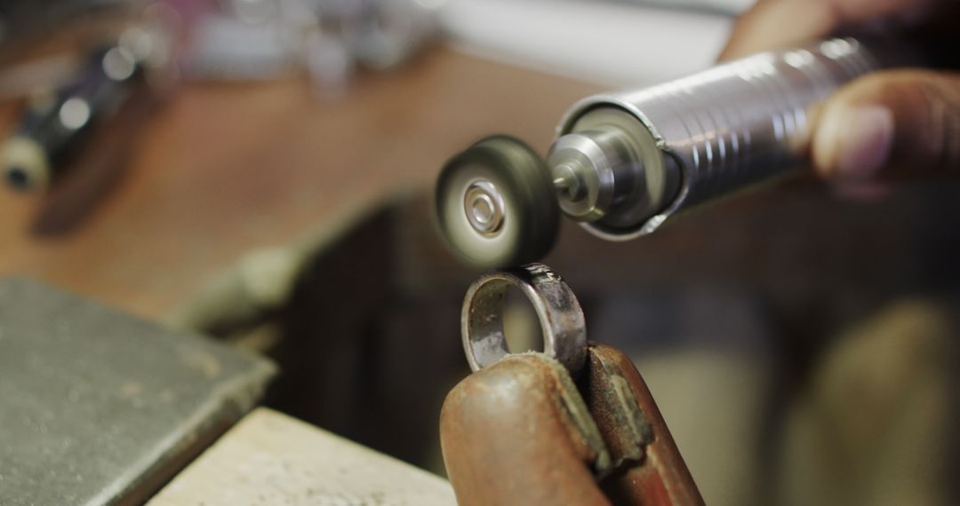 Close-up of Artisan Polishing Silver Ring with Rotary Tool - Free Images, Stock Photos and Pictures on Pikwizard.com