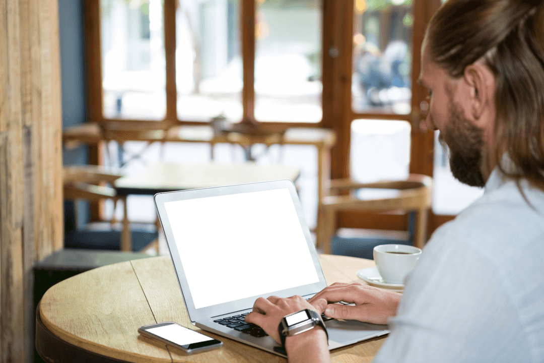 Transparent Tech Use: Man on Laptop in Coffee Shop