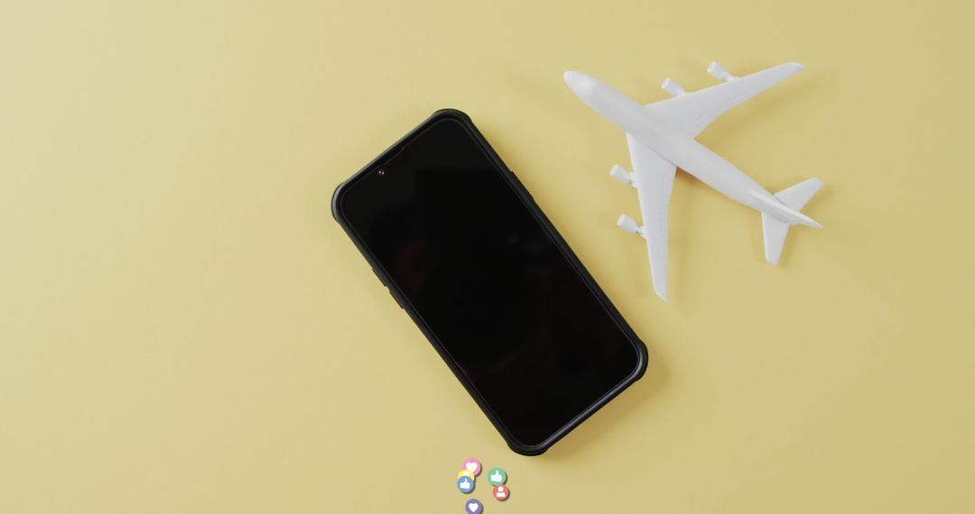 Travel Health Planning with Phone and Plane Model on Yellow Backdrop