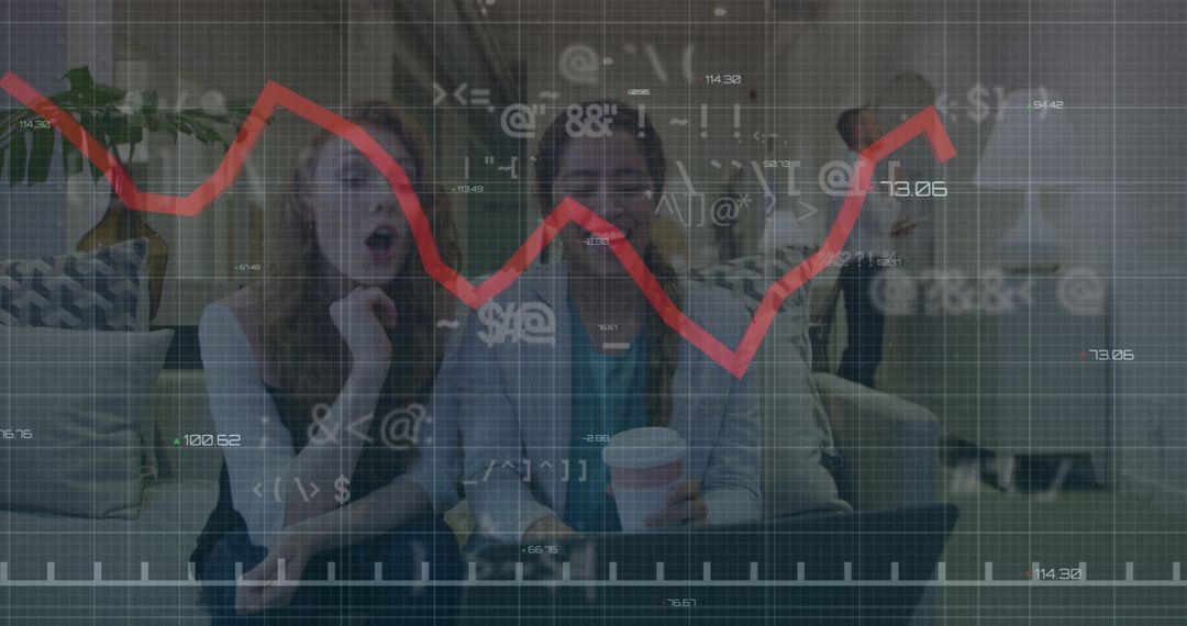 Businesswomen Analyzing Financial Data with Modern Graphs