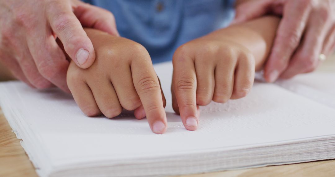 Adult Guiding Child Reading Braille, Hands Touching Dots - Free Images, Stock Photos and Pictures on Pikwizard.com