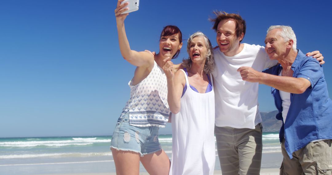 Joyful Multigenerational Friends Taking Selfie on Sunny Beach